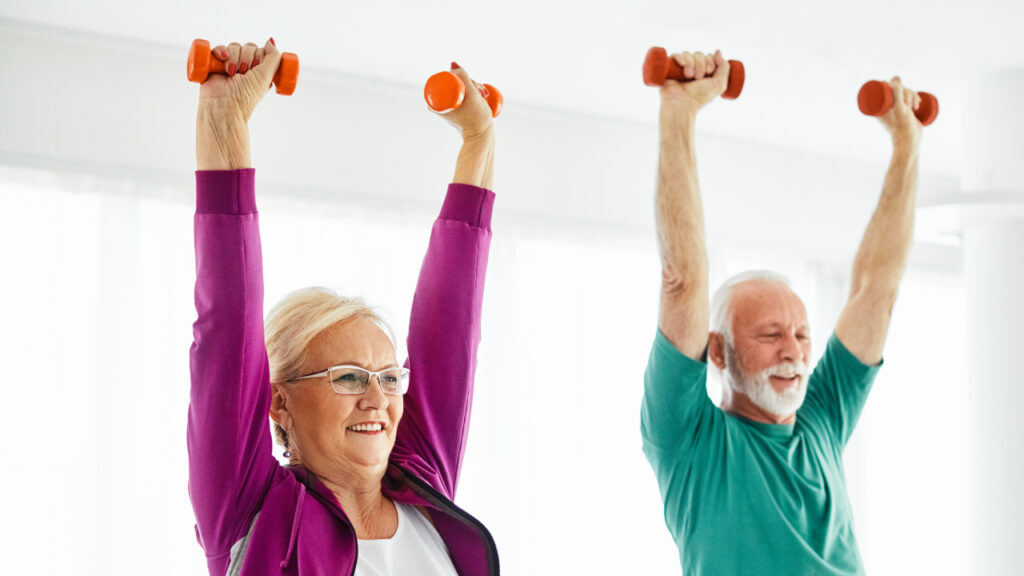 older adults exercising with dumbbells