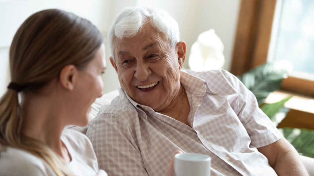young person communicating with an elderly person