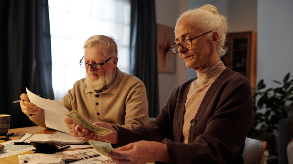 Elderly couple looking over their finances